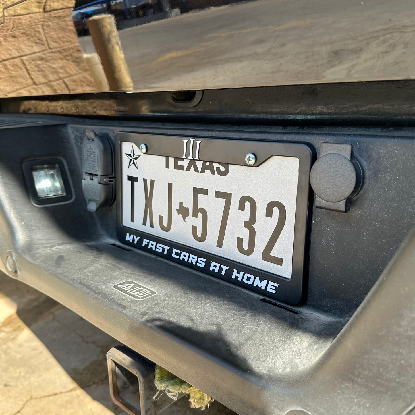 "MY FAST CAR IS AT HOME" PLATE FRAME